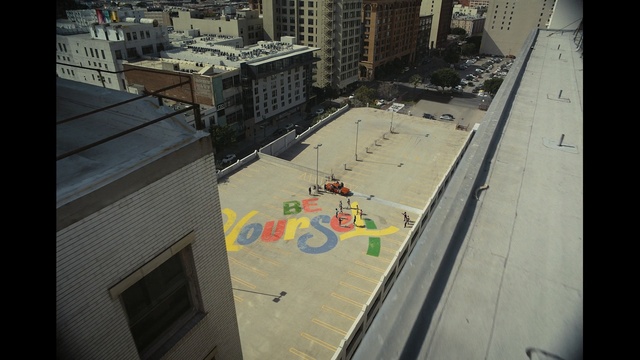 Video Reference: urban area, architecture, wall, city, recreation, building, roof, Person