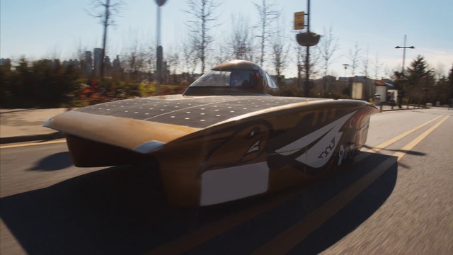 Video Reference: Automotive exterior, Vehicle, Sky, Car, Automotive design, Road, Roof, Solar vehicle, Wheel