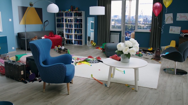 Video Reference: blue, room, interior design, furniture, table, living room, home, chair, house, flooring, Person