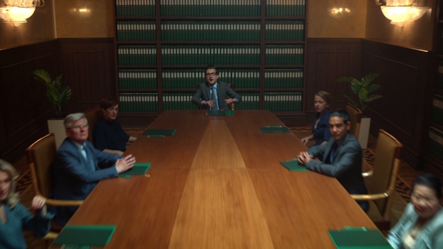 Video Reference: Room, Hardwood, Fun, Wood, Flooring, Leisure, Table, Sitting, Floor, Games, Person, Indoor, Child, Wooden, Girl, Young, People, Playing, Living, Group, Small, Little, Woman, Front, Boy, Laptop, Computer, Green, Using, Man, Game, Television, Standing, Large, Eating, Video, Ball