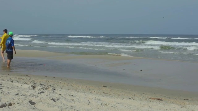 Video Reference: Body of water, Shore, Sea, Beach, Ocean, Coast, Natural environment, Wave, Sand, Coastal and oceanic landforms, Person