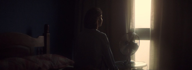 Video Reference: Black, Darkness, Light, Backlighting, Room, Photography, Electronic device, Hand, Sitting, Shadow