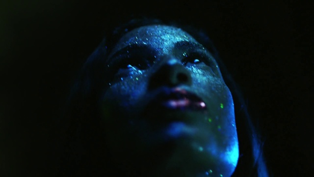 Video Reference: Black, Darkness, Light, Blue, Head, Human, Organism, Electric blue, Space, Fiction