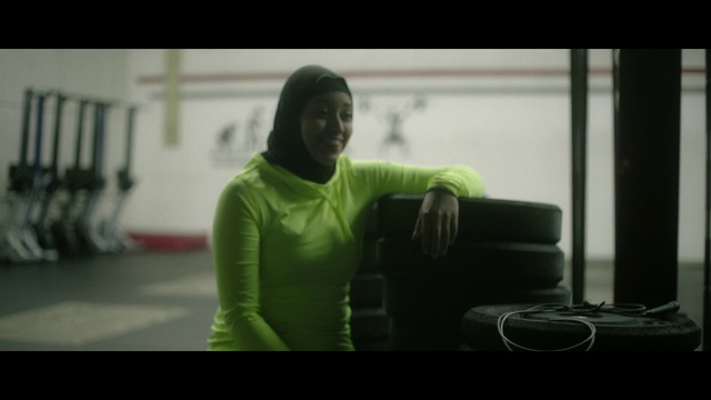 Video Reference: Green, Standing, Arm, Sitting, Physical fitness, Room, Muscle, Fictional character, Sports training, Photography