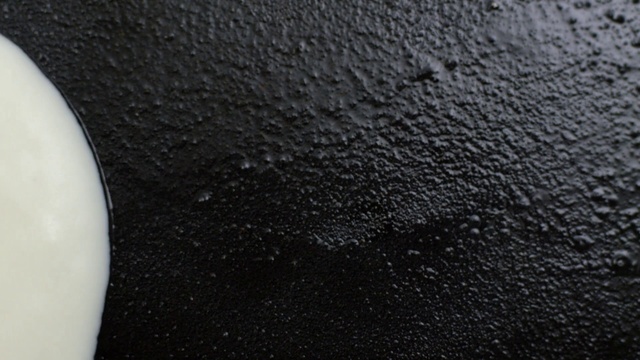 Video Reference: Black, Black-and-white, Denim, White, Sitting, Table, Food, Plate, Banana, Cake, Close, Abstract