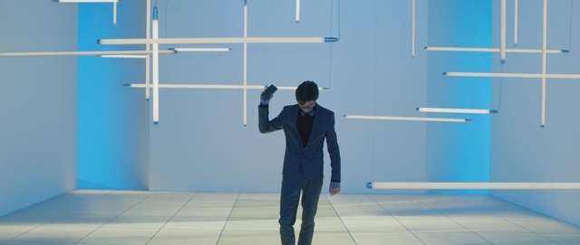 Video Reference: blue, standing, shoulder, line, floor, furniture, angle, flooring, Person