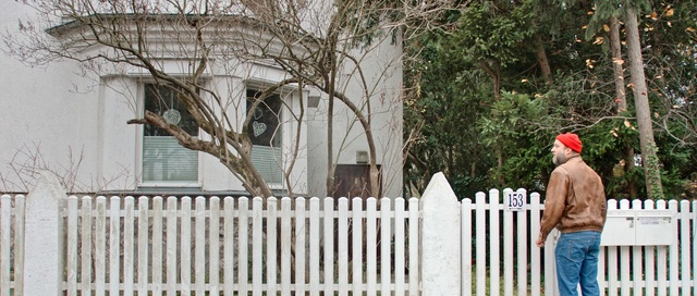 Video Reference: Picket fence, Fence, Home fencing, Property, Tree, Home, Outdoor structure, House, Real estate, Wood, Person, Outdoor, Building, Man, Front, Standing, Park, Sidewalk, Snow, White, Riding, Yard, Walking, Street, Holding, Dog, Large, Young, Bench, Red, Bear, Board, Zoo, Playing, Cemetery, Porch, Grave