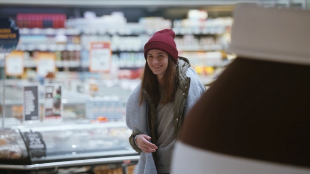 Video Reference: Snapshot, Supermarket, Headgear, Hand, Customer, Beanie, Cap, Photography, Retail, Grocery store, Person