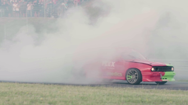 Video Reference: Smoke, Vehicle, Drifting, Car, Automotive design, Tire, Performance car, Automotive wheel system, Sports car, Autocross