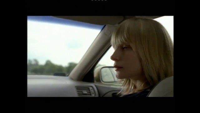 Video Reference: Hair, Face, Blond, Beauty, Driving, Windshield, Rear-view mirror, Vehicle door, Automotive design, Vehicle