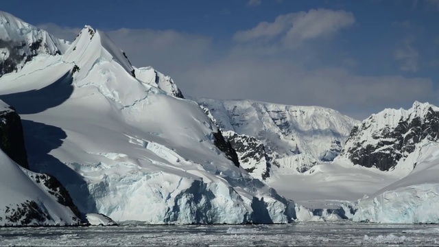 Video Reference: Mountainous landforms, Mountain, Glacial landform, Polar ice cap, Ice, Glacier, Mountain range, Arctic, Ice cap, Nunatak, Person