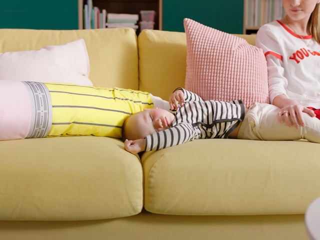 Video Reference: Yellow, Furniture, Pillow, Couch, Room, Cushion, Leg, Textile, Bedding, Linens