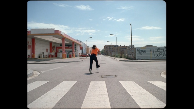 Video Reference: road, sky, infrastructure, urban area, lane, asphalt, town, pedestrian, street, shadow
