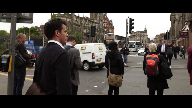 Video Reference: car, vehicle, street, transport, mode of transport, infrastructure, pedestrian, road, city, crowd, Person