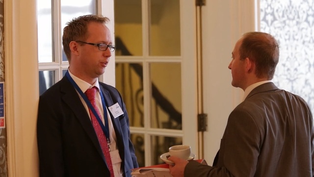 Video Reference: communication, academic conference, conversation, official, suit, event, energy, business, meeting, speech, Person