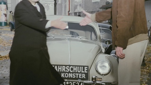 Video Reference: car, motor vehicle, vehicle, vintage car, automotive design, automotive exterior, classic car, classic, compact car, city car, Person