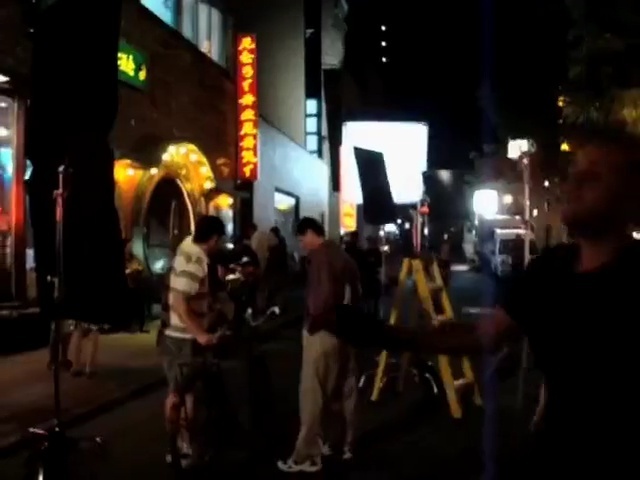 Video Reference: crowd, people, mode of transport, event, night, lighting, fun, darkness, pedestrian, recreation, Person