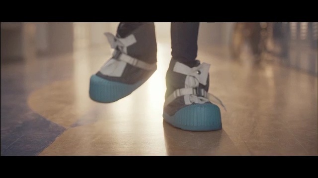 Video Reference: footwear, shoe, floor, leg, flooring, foot, outdoor shoe, space, Person