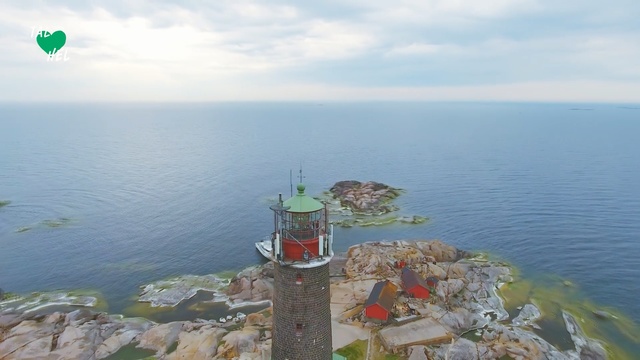 Video Reference: Promontory, Sea, Cape, Water, Lighthouse, Coast, Sky, Tower, Tourism, Ocean, Outdoor, Body, Boat, Man, Table, Food, Lake, Sitting, Large, Beach, Standing, People, Umbrella, Board, White, River, Cloud, Shore