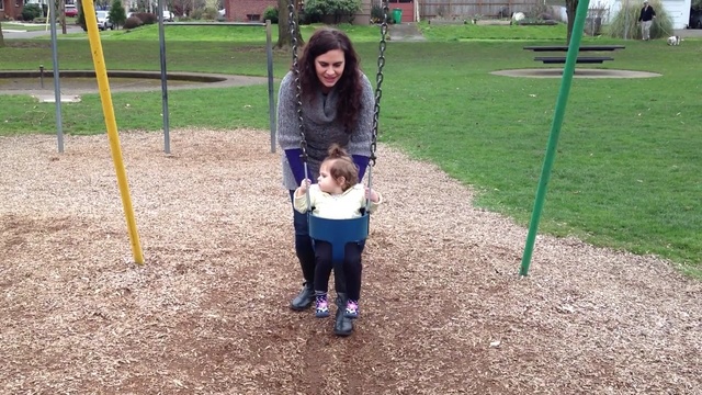 Video Reference: playground, outdoor play equipment, public space, day, swing, tree, play, child, grass, plant, Person