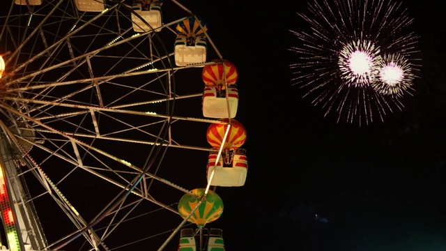 Video Reference: Ferris wheel, Amusement ride, Tourist attraction, Amusement park, Wheel, Fair, Recreation, Night, Sky, Fun