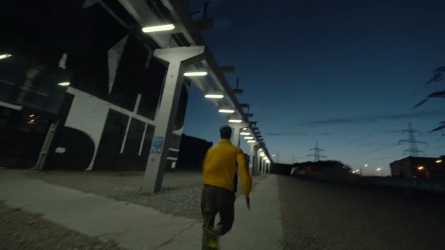 Video Reference: Photograph, Black, Blue, Light, Snapshot, Lighting, Standing, Yellow, Architecture, Street light, Outdoor, Man, Riding, Snow, Walking, Young, Jumping, Carrying, Board, Holding, Covered, Hill, Air, Street, Woman, Skiing, Slope, Ramp, Trick, Doing, Water, Road, Night, Flying, Sky, Person, Clothing