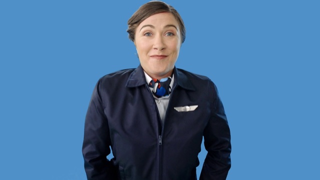 Video Reference: Outerwear, White-collar worker, Businessperson, Tie, Electric blue, Neck, Audio equipment, Gesture, Suit, Business