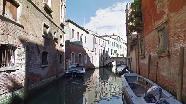 Video Reference: Canal, Waterway, Body of water, Neighbourhood, Channel, Town, Boat, Street, Vehicle, Building