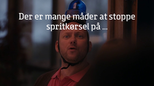 Video Reference: Human, Forehead, Photo caption, Font, Adaptation, Photography, Screenshot, Person, Indoor, Man, Front, Table, Holding, Sitting, Wearing, Red, Standing, Shirt, Computer, Laptop, Sign, Woman, Food, White, Room, Human face, Text, Clothing