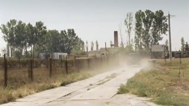 Video Reference: Land lot, Atmospheric phenomenon, Mode of transport, Dust, Road, Thoroughfare, Residential area, Rural area, Landscape, Vehicle