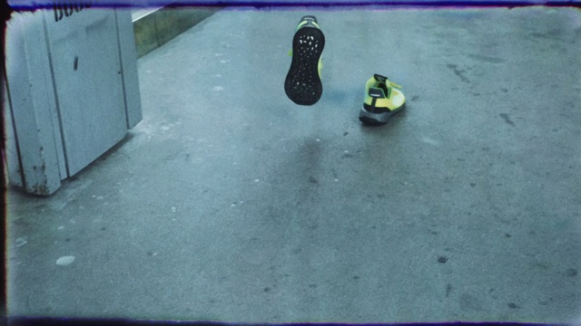 Video Reference: Floor, Footwear, Yellow, Leg, Shoe, Flooring, Foot, Table, Asphalt, Sport venue