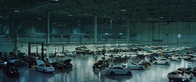 Video Reference: factory, structure, car, hangar, airport terminal, metropolis, mass production, building