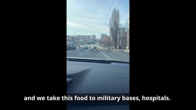 Video Reference: Sky, Building, Window, Asphalt, Tints and shades, Glass, Tree, Font, Urban design, Road