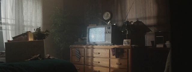 Video Reference: Furniture, Room, Chest of drawers, Desk, Still life photography, Photography, Electronics, Media, Darkness, Interior design