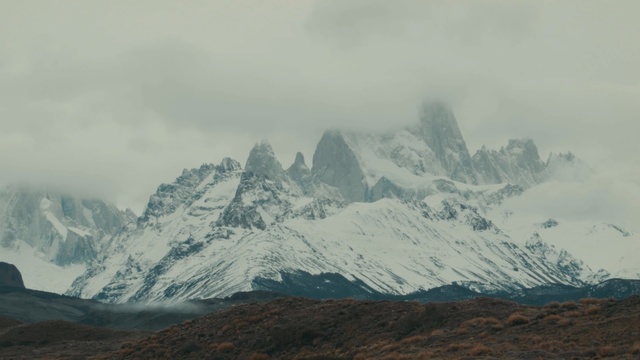 Video Reference: Mountainous landforms, Mountain, Mountain range, Highland, Ridge, Atmospheric phenomenon, Sky, Alps, Massif, Fell, Person