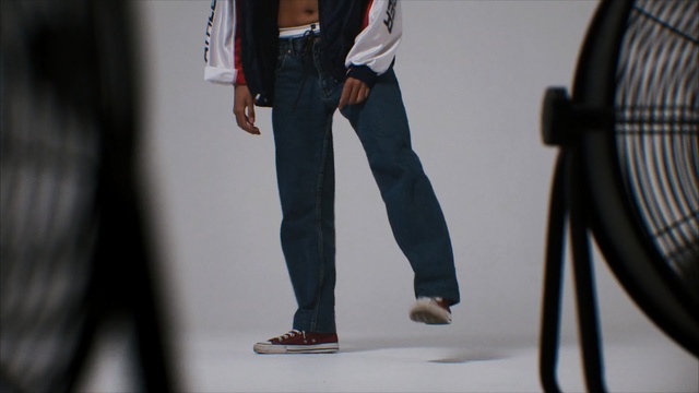 Video Reference: jeans, denim, shoe, fashion, trousers, suit, Person