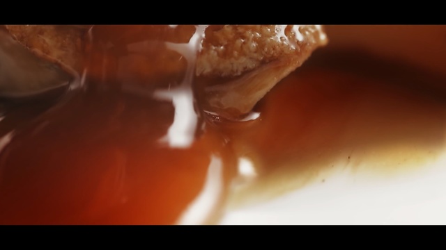 Video Reference: close up, macro photography, mouth, caramel color, chocolate