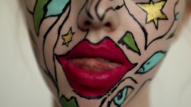 Video Reference: Face, Tattoo, Head, Arm, Skin, Mouth, Cartoon, Cheek, Forehead, Close-up