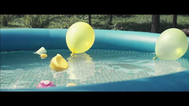Video Reference: water, blue, yellow, swimming pool, daytime, sky, sunlight, balloon, leisure, fun