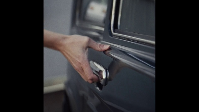 Video Reference: Vehicle door, Automotive exterior, Bumper, Hand, Finger, Door, Auto part, Automotive lighting, Window, Photography