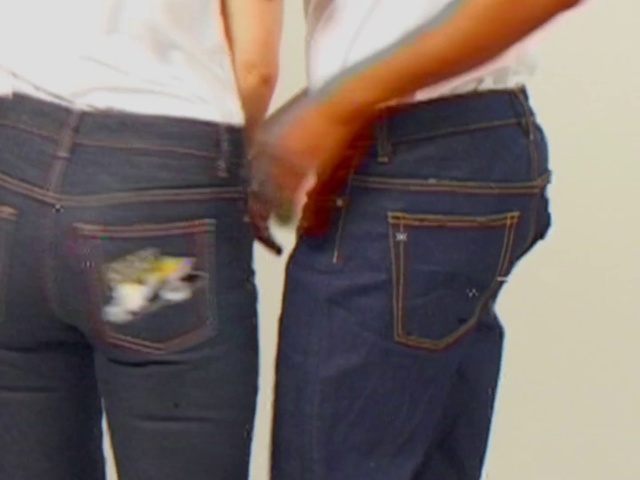 Video Reference: Denim, Jeans, Clothing, Pocket, Textile, Waist, Fashion, Trousers, Hip, Shorts, Person, Indoor, Woman, Holding, Hand, Suit, Wearing, Standing, Man, Suitcase, Luggage, Using, Young, Phone, Handbag, Luggage and bags, Boot, Belt, Jean, Fashion accessory, Casual dress, Bag, Shirt, Sleeve, Skirt, Miniskirt, Trouser