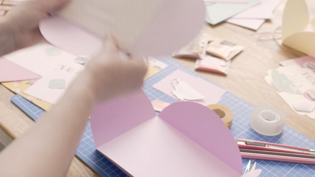 Video Reference: Design, Paper, Hand, Stationery, Finger, Circle, Writing, Construction paper, Illustration, Paper product