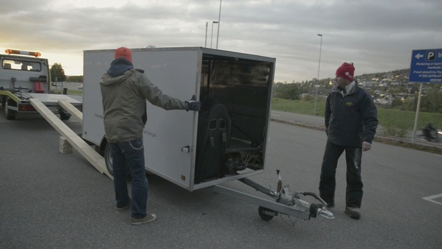 Video Reference: vehicle, transport, trailer, asphalt, car, automotive exterior, motor vehicle, Person