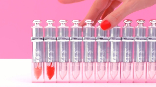 Video Reference: Pink, Lip gloss, Lipstick, Lip, Material property, Cosmetics, Nail, Test tube, Gloss, Person