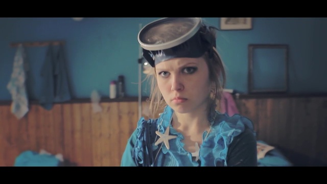 Video Reference: blue, face, human hair color, lady, head, beauty, girl, screenshot, hairstyle, snapshot, Person