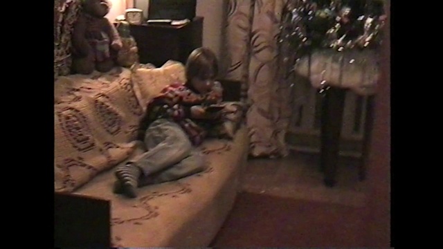 Video Reference: Tattoo, Couch, Art, Leg, Human, Room, Mouth, Human body, Interior design, Temple