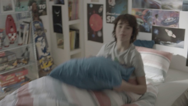 Video Reference: Bedroom, Room, Furniture, Bed, Arm, Leg, Joint, Linens, Bed sheet, Neck, Person