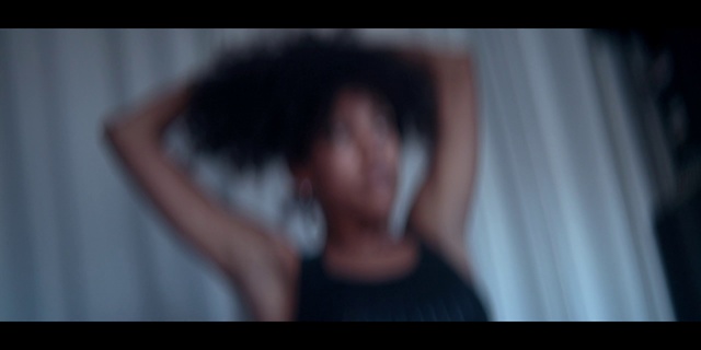 Video Reference: Face, Black, Head, Nose, Black hair, Hand, Mouth, Eye, Arm, Cheek