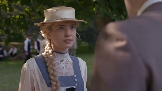 Video Reference: Hat, Headgear, Gentleman, Fashion accessory, Fedora, Person, Outdoor, Wearing, Grass, Standing, Young, Holding, Looking, Man, Little, Boy, Table, Dress, Woman, Suit, White, Smiling, Girl, Shirt, Cake, Pink, Street, Plate, Sun hat, Human face, Cowboy hat, Clothing, Fashion, Costume hat