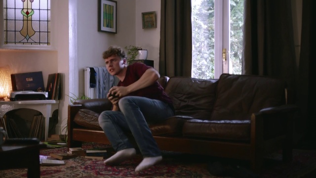 Video Reference: Living room, Couch, Room, Furniture, Sitting, Light, Floor, Leg, Flooring, Window